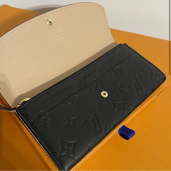 Authentic Louis Vuitton Emilie Monogram Empreinte Leather Wallet in black - Picture 2 of 9
